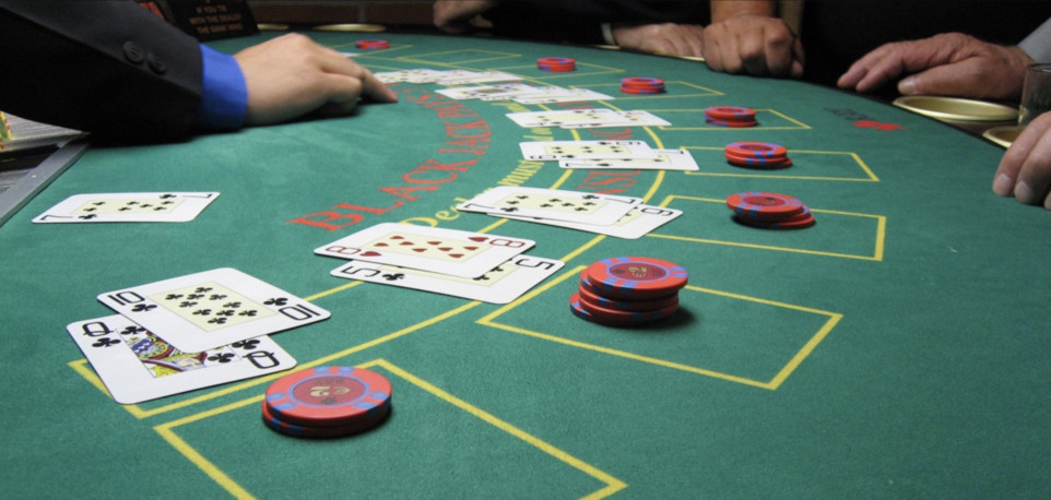 Playing blackjack on a blackjack table.